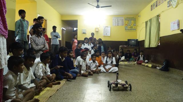 Students watching a robot